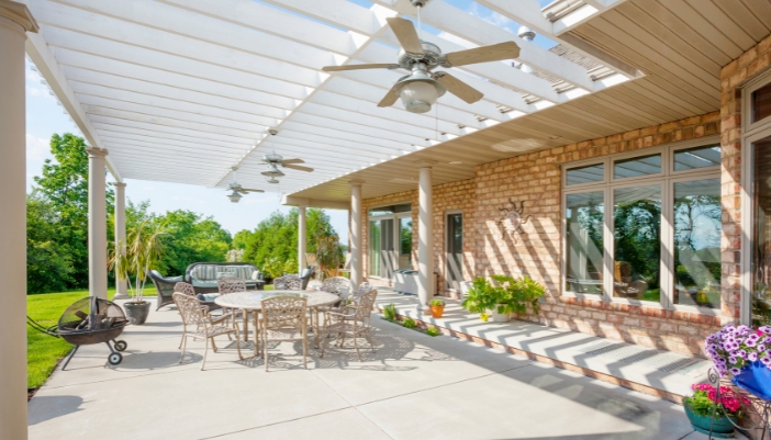 Furn_outdoor-furniture-summer-guide_4.jpg A back patio with potted plants