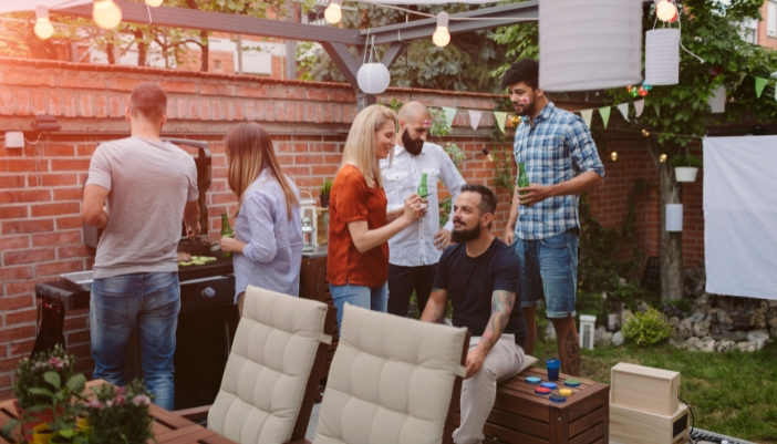 Furn_outdoor-furniture-summer-guide_5.jpg Friends hanging out in back patio for BBQ