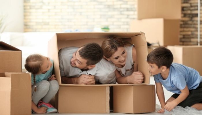 Furn_Summer-Kids-Activities_5.jpg Family having fun with cardboard boxes