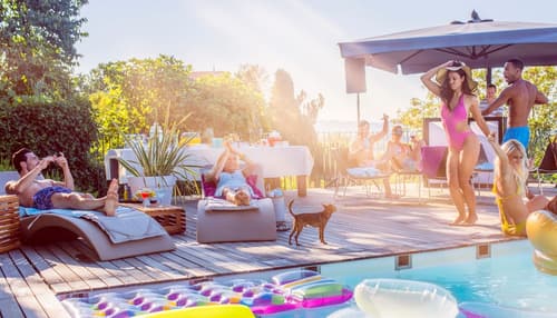 Outdoor pool area with comfortable patio furniture and shading Outdoor pool area with comfortable patio furniture and shading