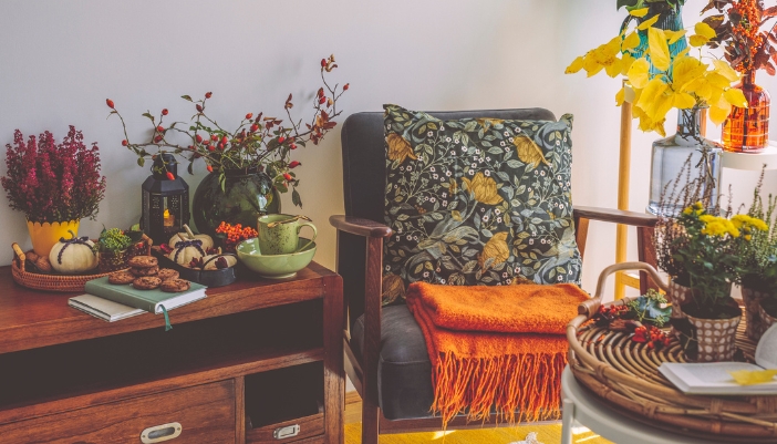 A warm neutral inspired sitting room filled with fall flora