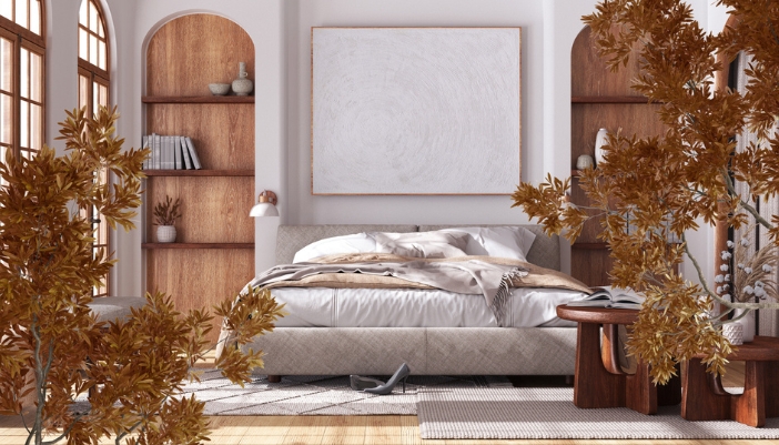 A bedroom with warm neutrals slowly incorporated into it