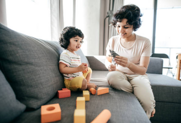 Mother and Daughter on Sectional Sofa