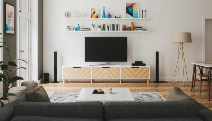 A brightly lit, Scandinavian inspired living room with a media console.