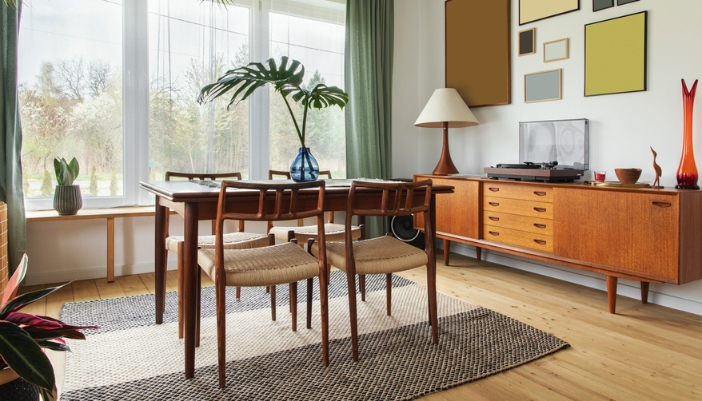 A vintage-inspired dining room with wooden accents and a vinyl player to the side.