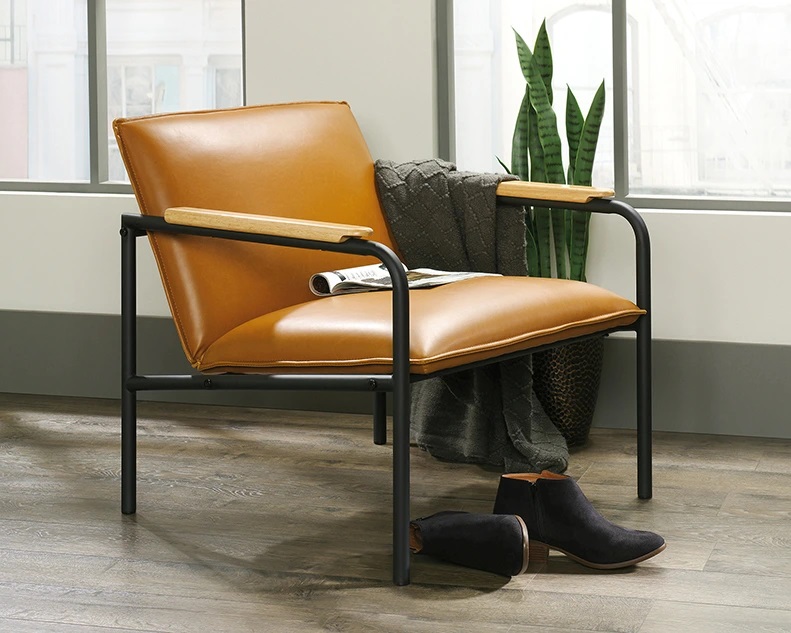 Camel-colored accent chair with leatherette upholstery and wood-capped arms