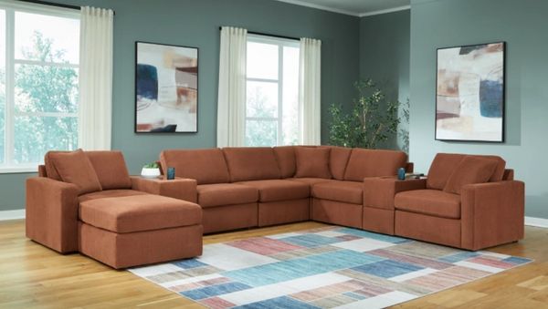 The Signature Design by Ashley Modmax sectional in a modern living room