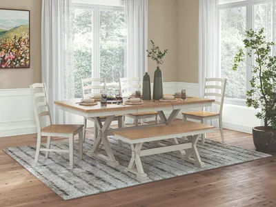 Credit: Signature Design by Ashley The Signature Design by Ashley Purlaney 5-piece dining room set with bench in a farmhouse-style dining room