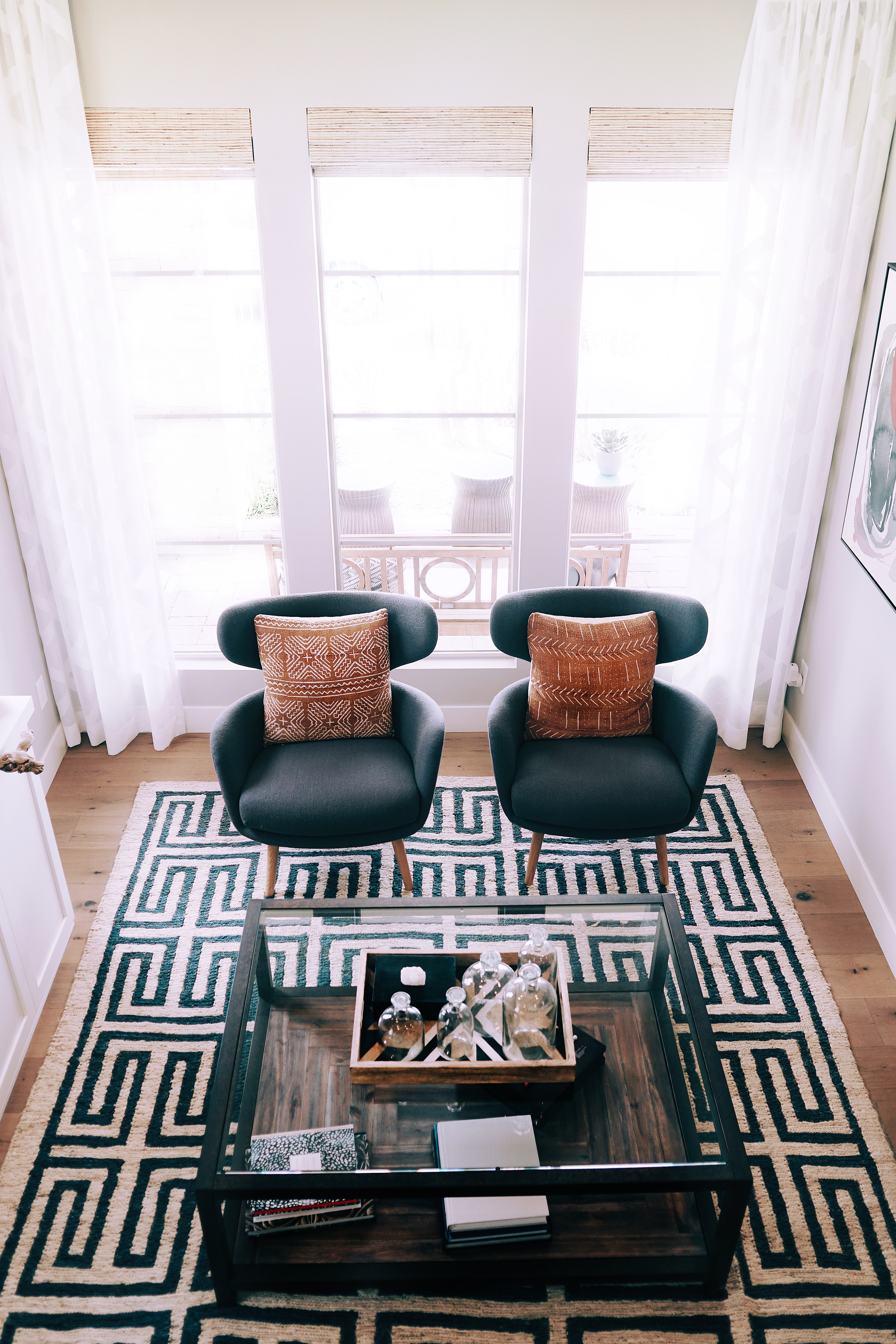 Pair of modern style chairs placed on a black and white rug
