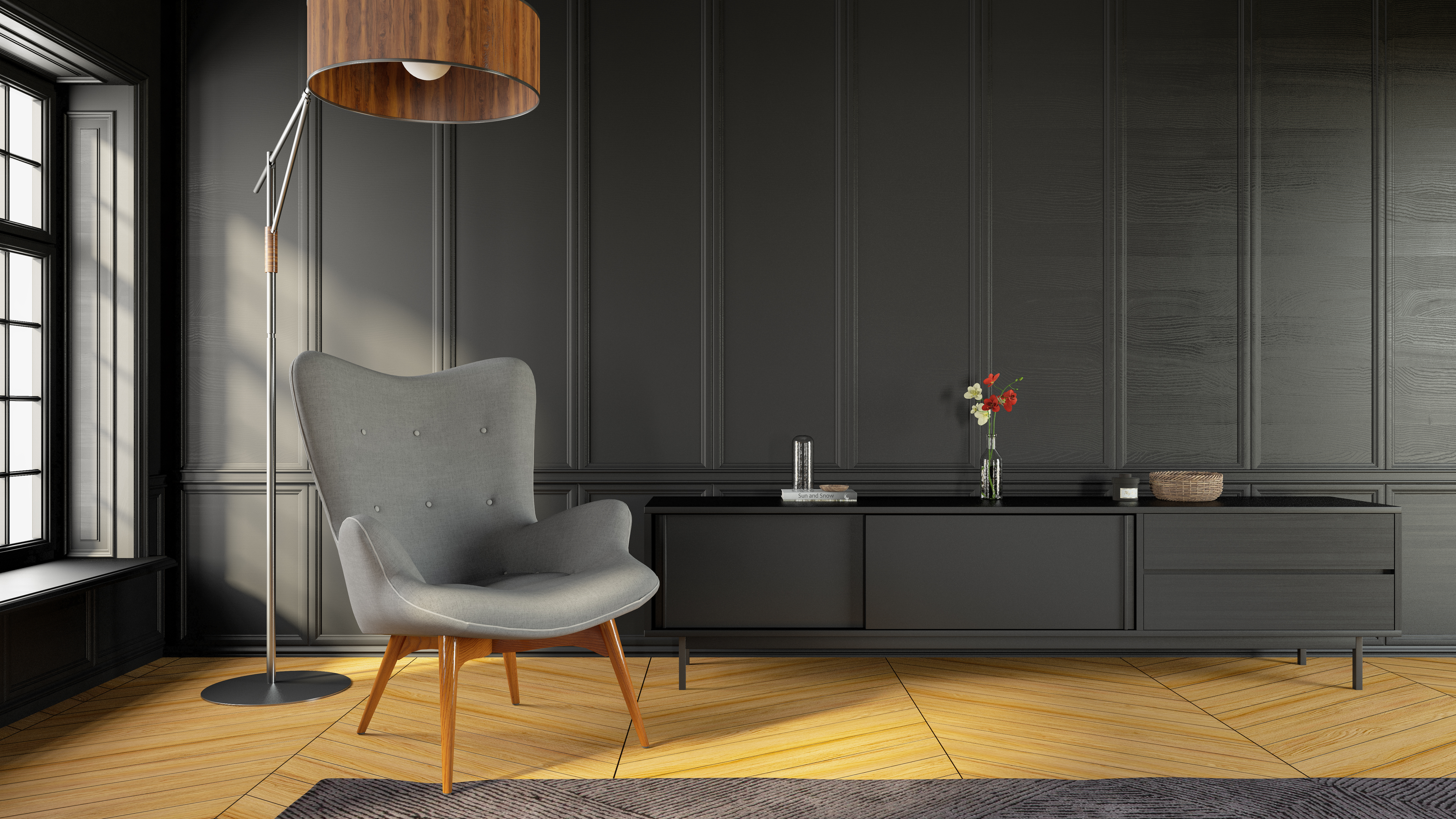 A grey modern wingback chair in a corner with a lamp 