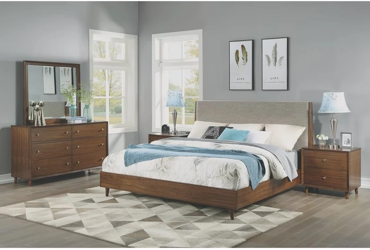 The Flexsteel Ludwig collection upholstered queen bed frame with matching case pieces and blue and white bedding 