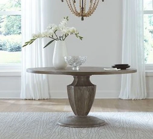 Credit: Liberty Furniture The Liberty Furniture Westfield brown pedestal table in a white-themed setting