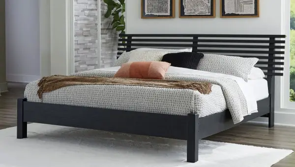 Credit: Signature Design by Ashley The Signature Design by Ashley Danziar collection panel bed with bedding and décor