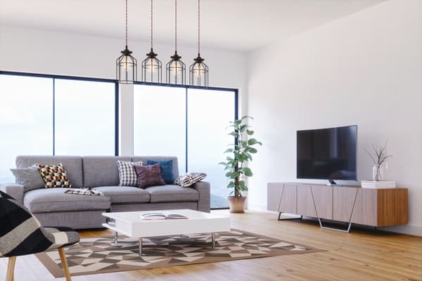 iStock Credit: imaginima A modern living room with grey furniture