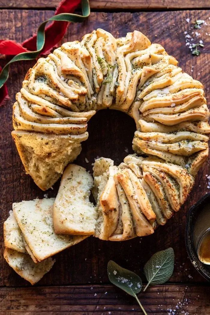 Half Baked Harvest Pull apart bread wreath on a wood table