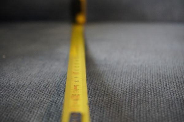 A blurry, extended tape measure 