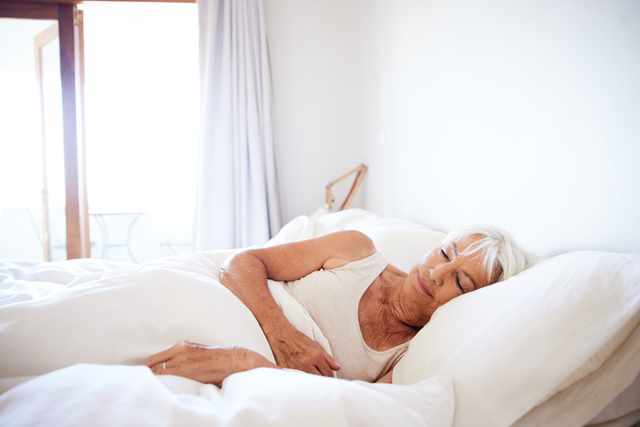 senior man breathing clearly while sleeping in an inclined position