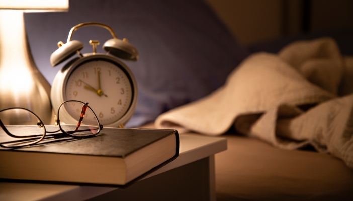 Matt_Reading-Before-Bed_5.jpg A cool and dark bedroom with a bedside lamp, perfect for reading