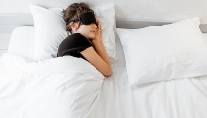 Woman sleeping on her left side