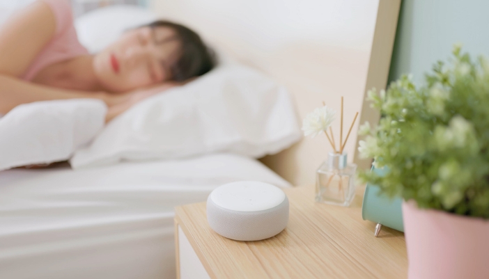 Matt_DIY-Aromatherapy-Solutions_6.jpg A woman sleeping with a reed diffuser next to her on her nightstand