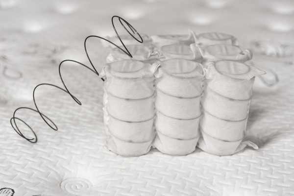 A close-up of broken mattress coils