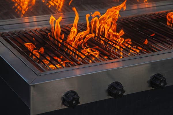 iStock Credit: serts A close-up of a flare up on a gas grill