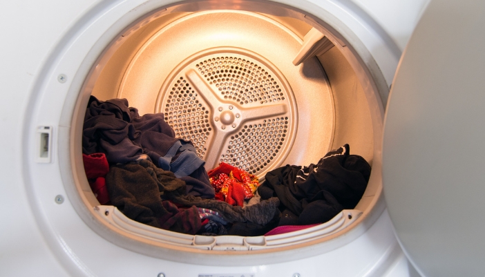 Serv_Dryer-Smells_2.jpg Closeup of a load of damp clothes sitting in the dryer