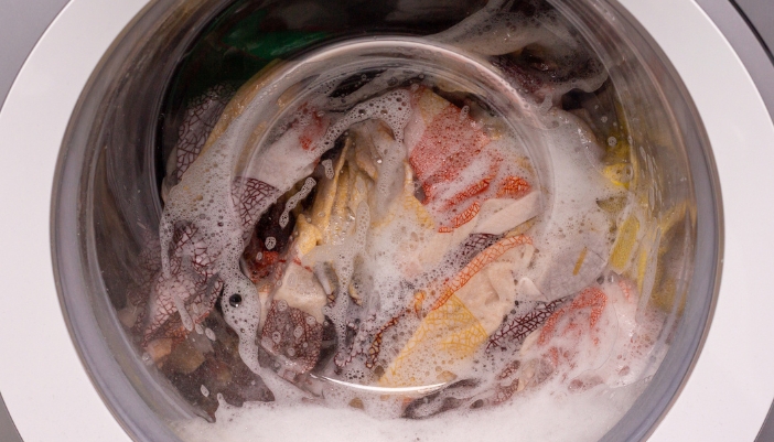 Serv_Washer-Dryer-Combo-Problems_4.jpg Closeup of a washer cycle and a lot of suds