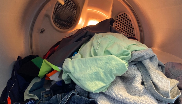 Interior view of half of load of laundry in the dryer