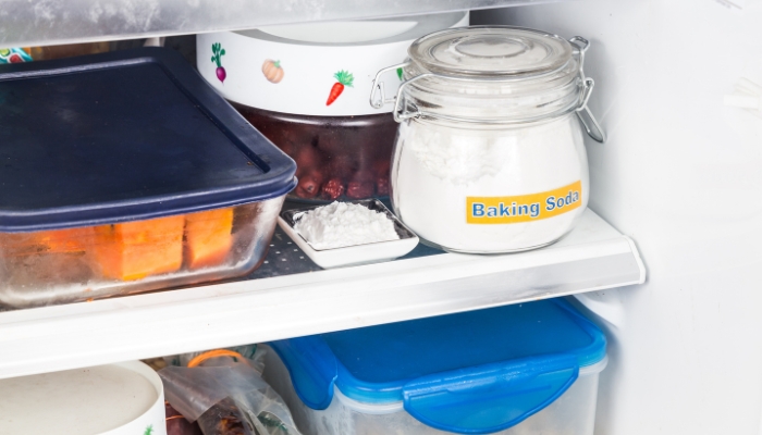 Serv_Fresh-Fridge-Steps_4.jpg Closeup of baking soda in the fridge used to help deodorize it naturally