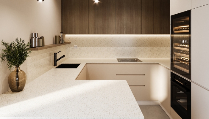 A modern, luxury kitchen with warm lighting and a built-in wine fridge.
