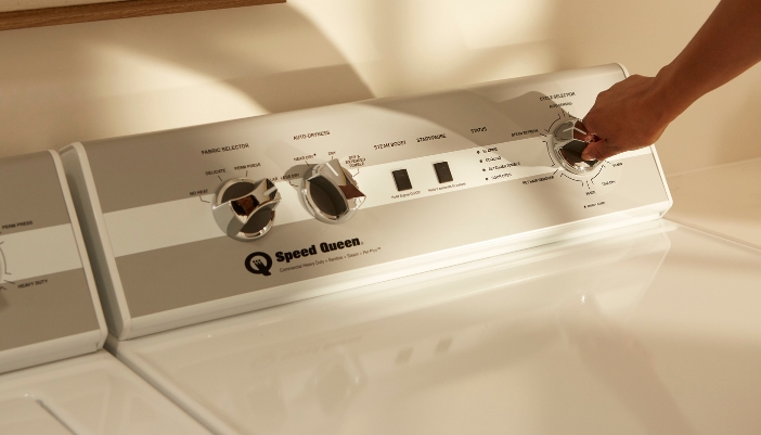 A close-up of Speed Queen laundry controls.