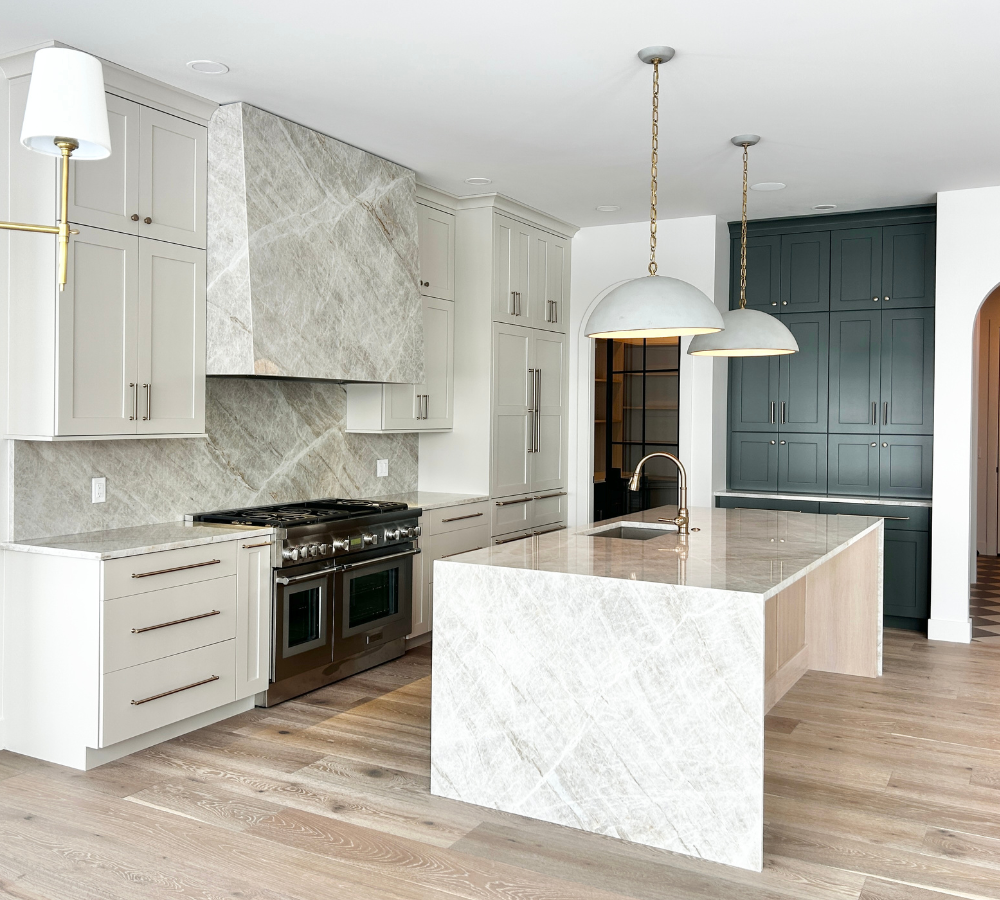 kitchen design in a quad cities home from Village Home Stores with accessible beige, white oak sand, and shade grown green cabinetry
