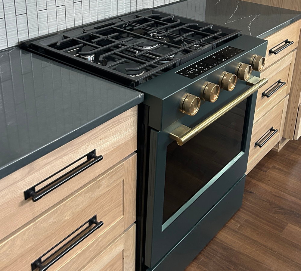 kitchenaid juniper range in white oak kitchen with gray quartz counters