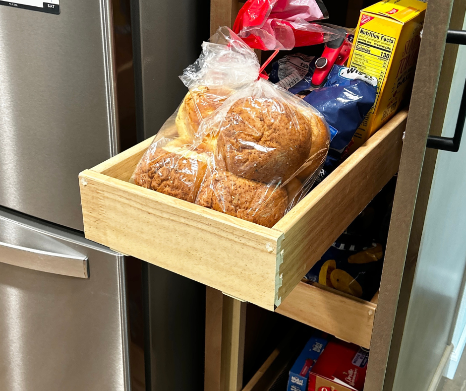close up image of pantry items on adjustable sliding pantry cabinet shelves