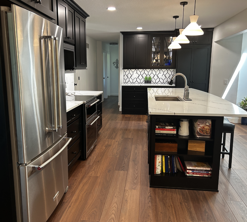 black cabinet kitchen design with bookshelf on end of kitchen island design