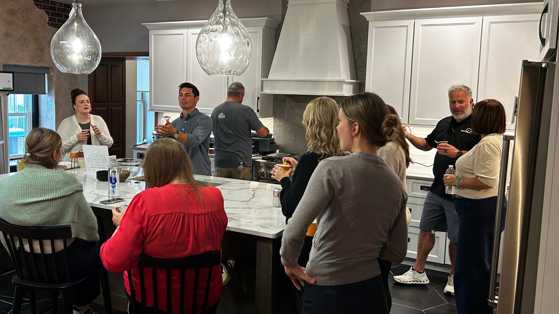 village home stores staff soup cookoff in showroom