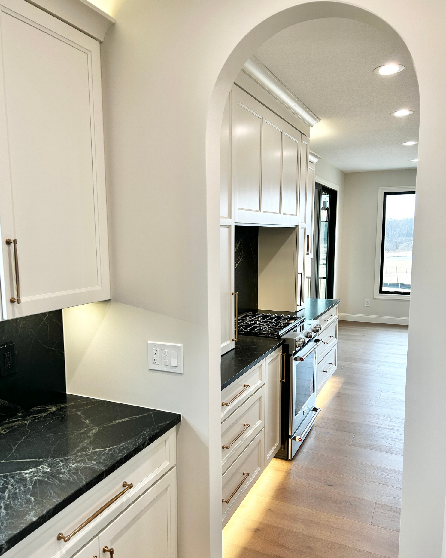 butlers pantry doorway with arch looking out to kitchen