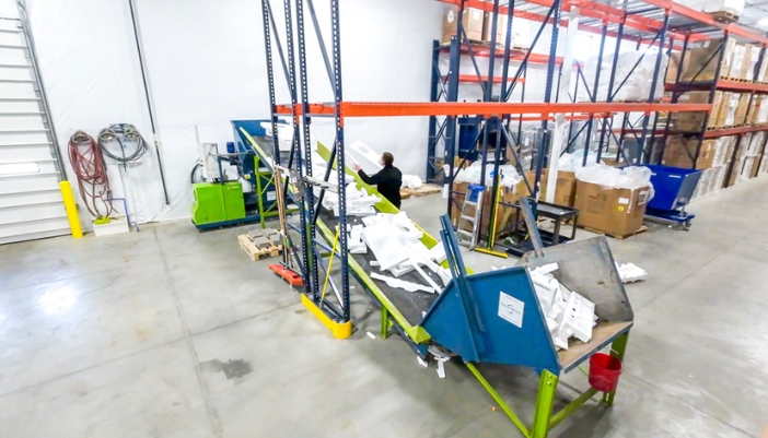 A conveyor belt loads recyclable materials.