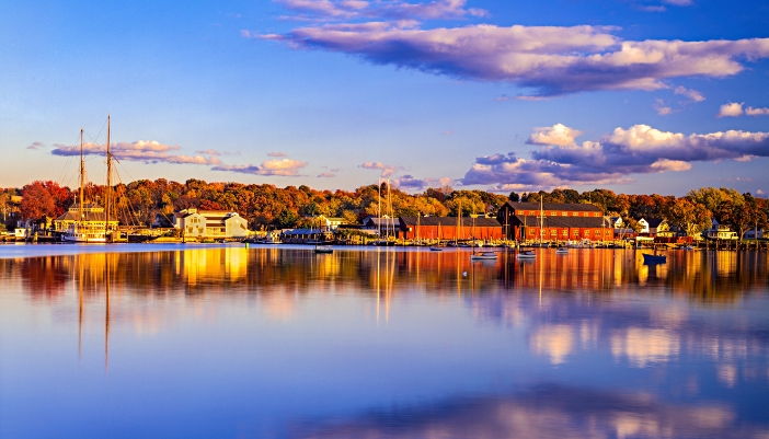 Historic steam train traveling through the Connecticut River Valley in the fall