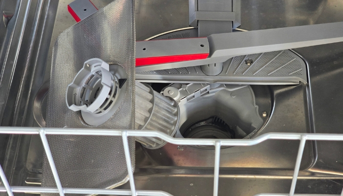 A close-up of a dishwasher filter