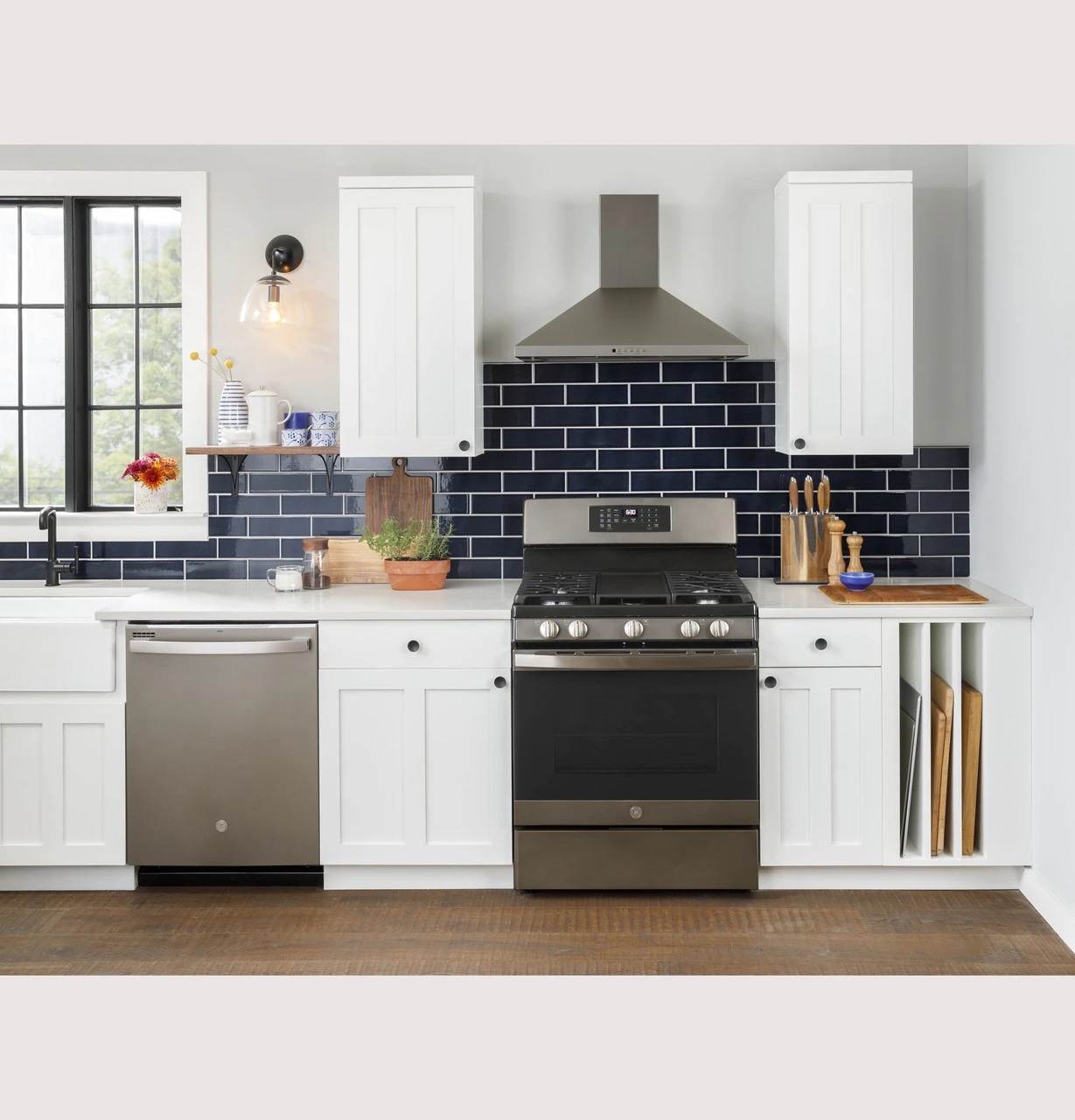 Credit: GE ge JGB735EPES gas range against white cabinetry and blue subway tile