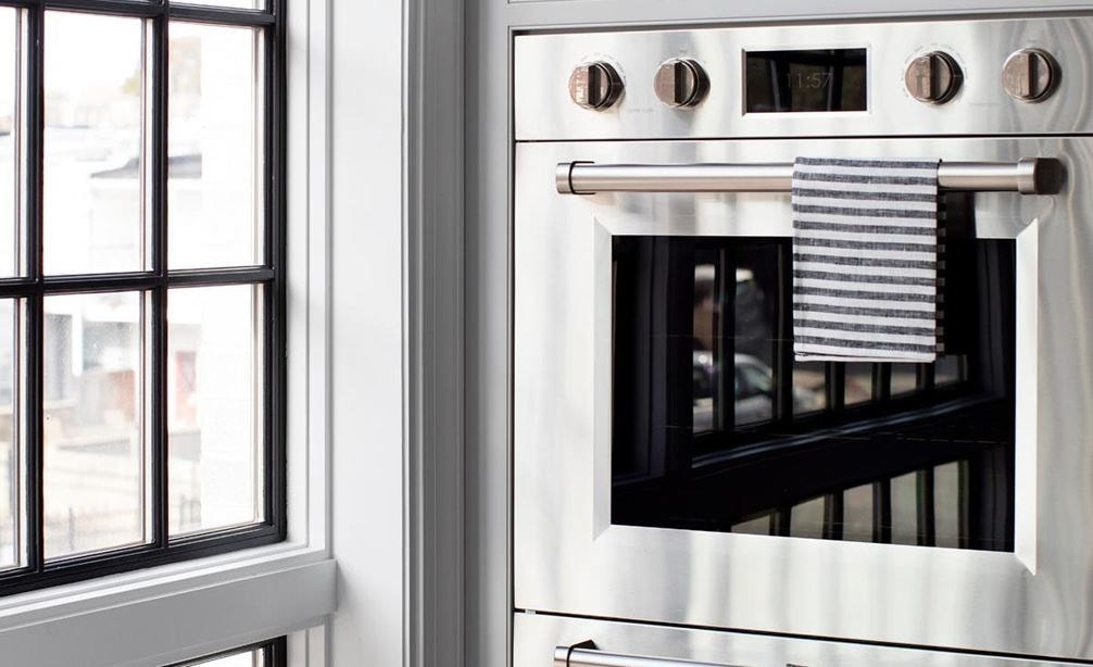 Up close look at Wolf M Series double wall oven in Baltimore Row kitchen design by Bria Hammel