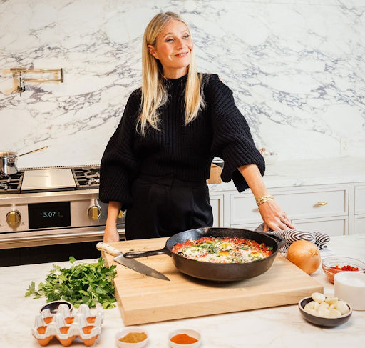 Actress Gwyneth Paltrow smiles as she cooks in her Monogram kitchen 