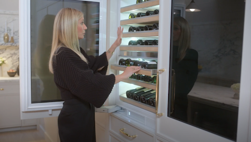 Gwyneth Paltrow reviews the contents inside a Monogram wine sommelier 