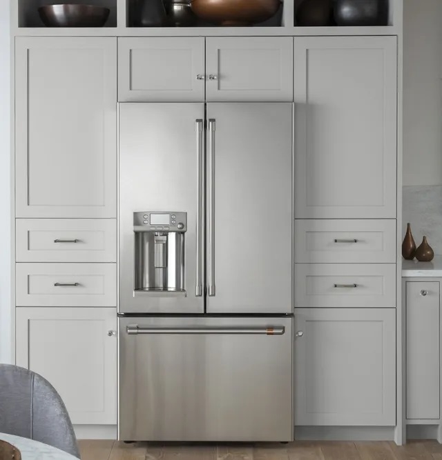 Front view of GE Cafe French door refrigerator with water dispenser 