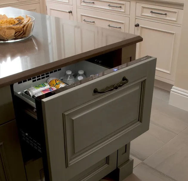 Thermador T24UC900DP refrigerator drawer shown ajar with beverages inside 