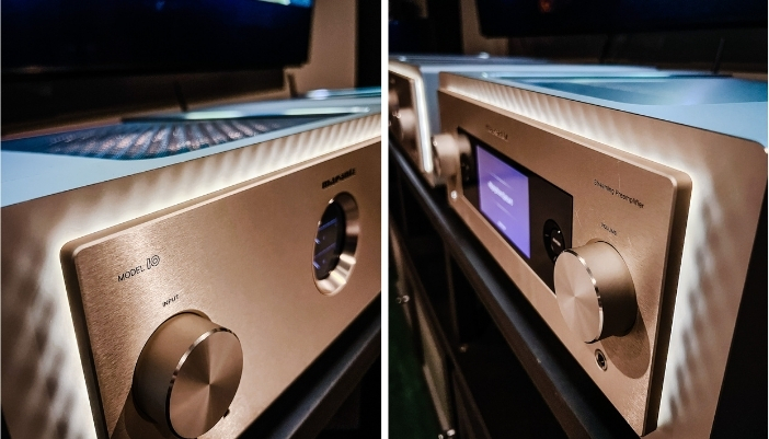 A pair of rose gold, brass amplifiers
