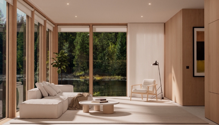 A room full of windows with modern furniture and a TV.