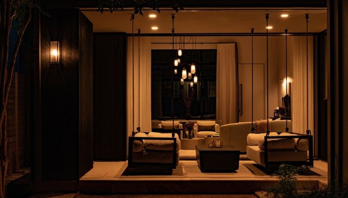 A dimly lit living room in a modern home.